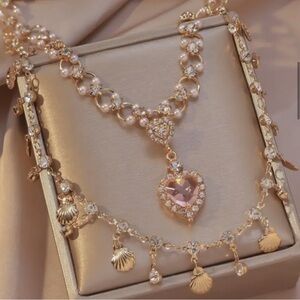 Elegant Gold and Pink Necklace with Intricate Design